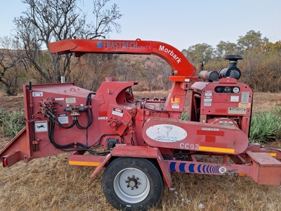 Tree shredder hire machine in action